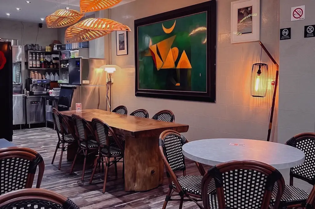 Wide-angle view of Hup Lok restaurant dining area on Havelock Road, featuring warm lighting, modern wooden furnishings, and a cosy setting for enjoying traditional pomfret fish soup.